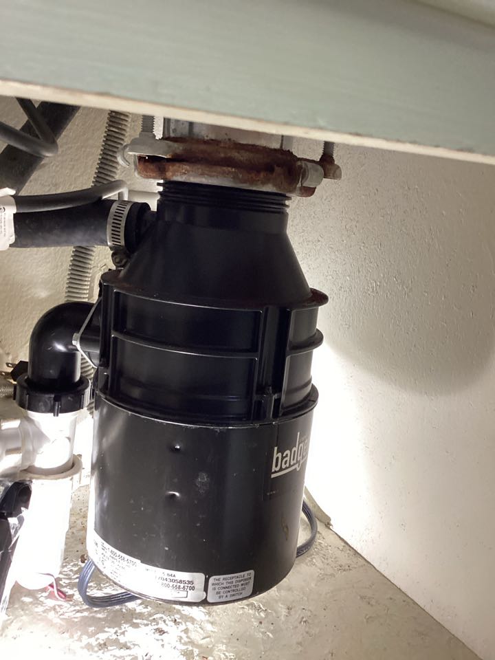 Garbage disposal and drain clogged for kitchen sink in Laguna Woods, California for a single-family two bedroom house