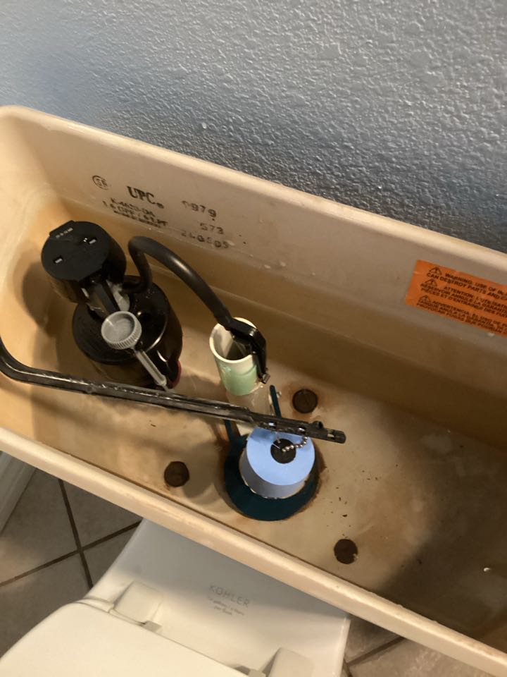 Install fill valve in flapper in master bedroom toilet in Azusa, California
