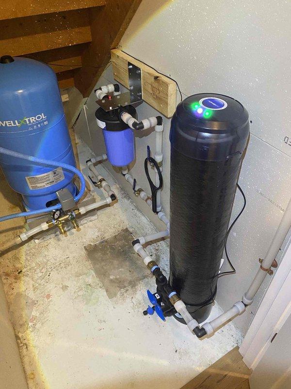 Installed Pioneer filtration system designed for Lead (99.62% reduction), PFOA/PFOS (97.9% reduction), and chlorine (>85% reduction) treatment. Complete installation included necessary piping connections to existing water system with sediment filter and additional filter. System was properly connected with PVC pipes and valves, with electrical routed through wall into laundry closet for power supply. Installation was completed successfully with all components functioning as intended.