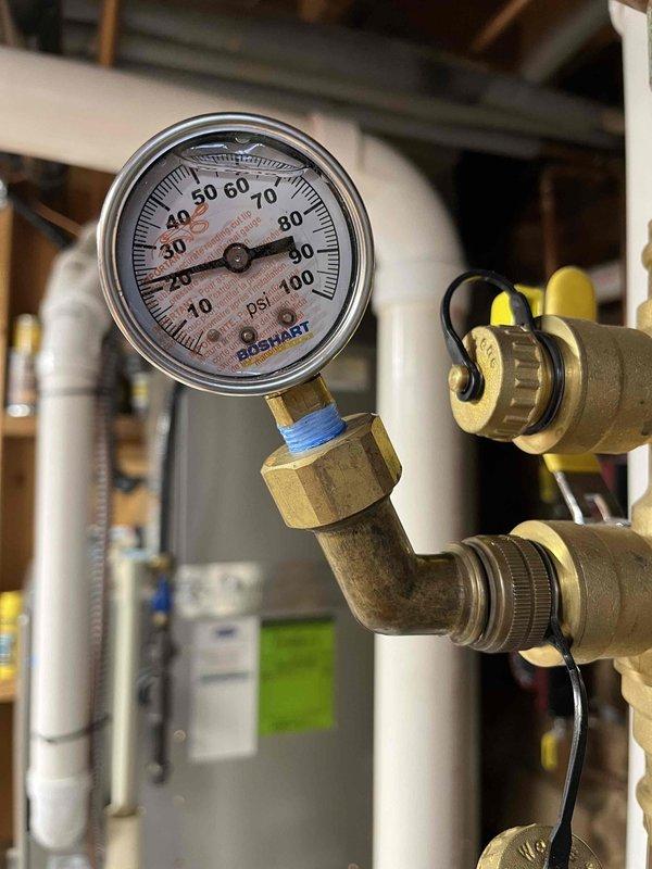 Responded to callback for leaking relief valve. Discovered system operating at excessive pressure (approximately 23 PSI), with malfunctioning pressure regulator. Previous relief valve replacement did not resolve issues with boiler shutdowns, which required multiple manual resets likely due to loose wire harness. Provided estimate for new feed and backflow prevention assembly.