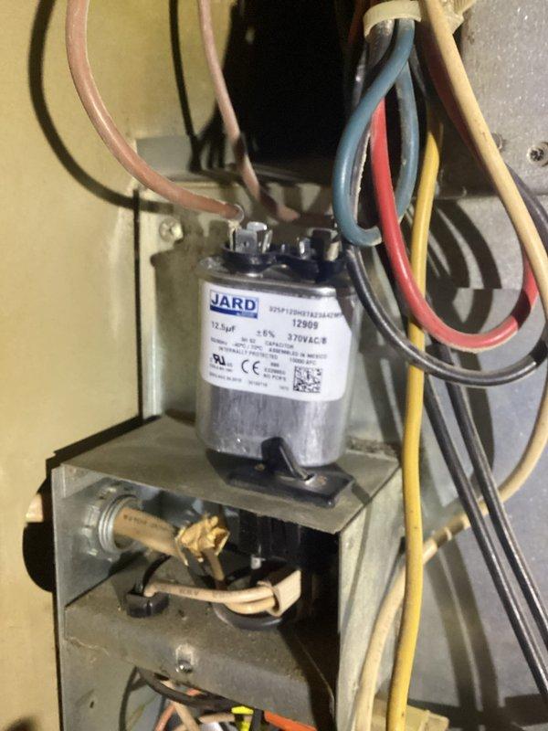 Responded to emergency no-heat call for customer with aging furnace system. Diagnosed failed capacitor causing system failure. Removed worn capacitor and installed new JARD 12.5μF 370VAC replacement unit, restoring proper system operation.
