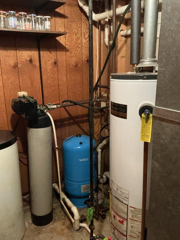 Completed annual preventative maintenance on residential furnace system. Inspected blower assembly and motor functionality as part of routine service. Documented condition of water heater and water treatment system components in the utility room for reference.