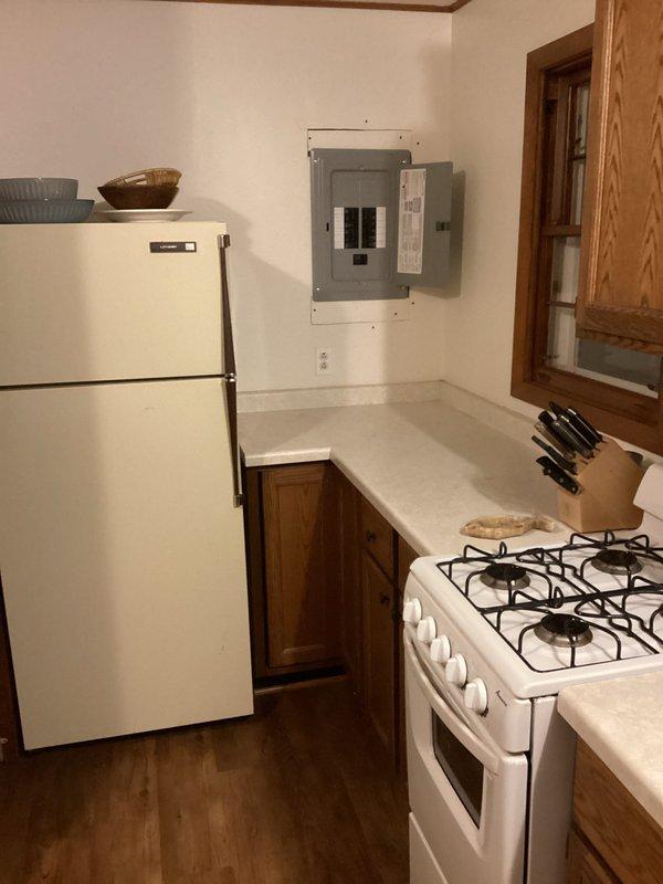 Installed new Square D 100-amp main circuit breaker panel with 30 spaces, including installation of 10 single-pole breakers, 2 AFCI breakers, and 1 double-pole breaker. Completed exterior grounding to code requirements. Panel was successfully mounted and wired in kitchen area with proper conduit routing; additional work beyond initial scope was performed to meet customer requirements.