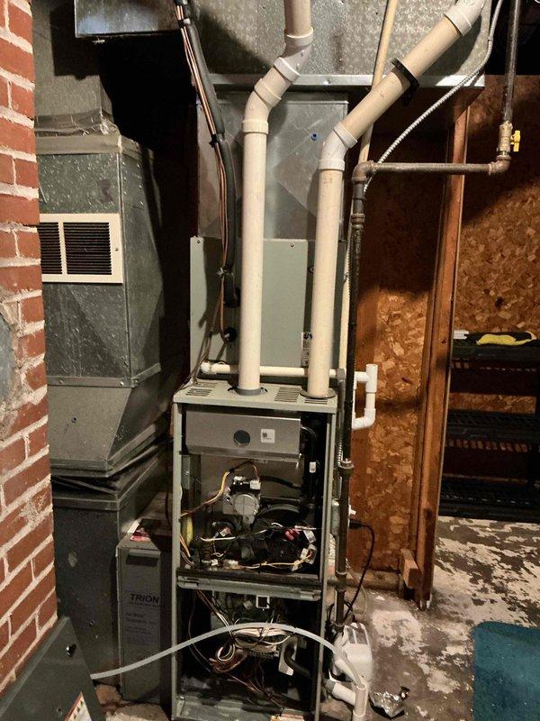 Diagnosed no-heat complaint on older furnace system by identifying clogged pressure switch line, which was preventing proper operation. Cleaned obstruction from pressure switch line and restored system functionality. Noted visible signs of aging on vent components and surrounding structure that may require attention in future service visits.