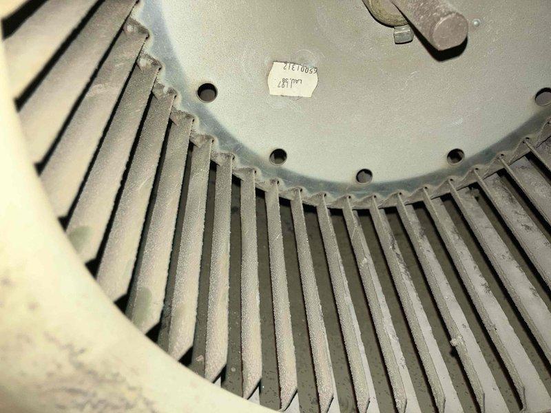 Responded to no heat complaint on 10+ year old LP/wood furnace. Diagnosed seized blower motor, documented condition with photos showing dust accumulation and wear on blower wheel and motor assembly. Replaced blower motor, restoring heat function. Recommended full unit replacement due to age and condition.