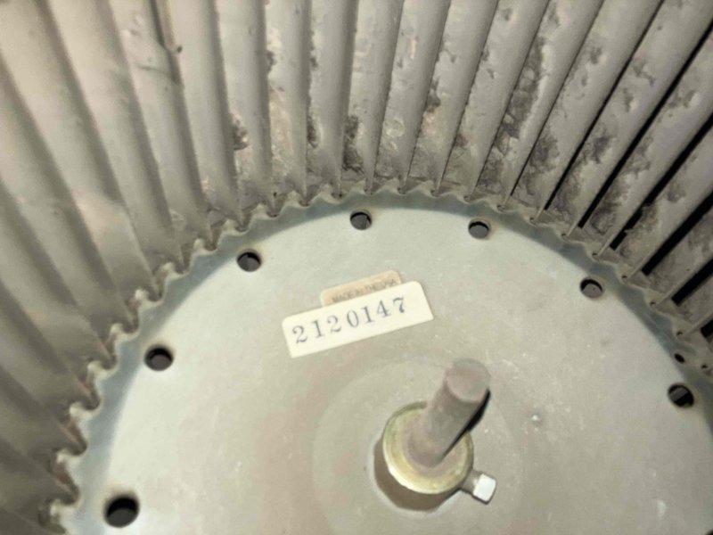 Responded to no heat complaint on 10+ year old LP/wood furnace. Diagnosed seized blower motor, documented condition with photos showing dust accumulation and wear on blower wheel and motor assembly. Replaced blower motor, restoring heat function. Recommended full unit replacement due to age and condition.
