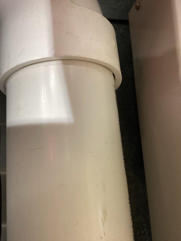 Responded to service call for furnace exhaust issue. Identified poorly glued PVC pipe joints leaking condensation from the exhaust system. Removed damaged section and replaced with new PVC piping, restoring proper operation of the furnace exhaust line.