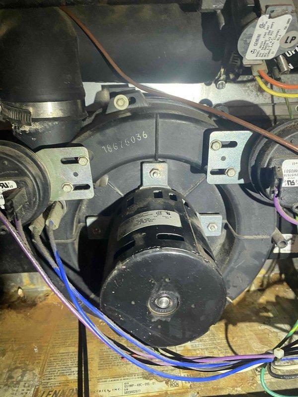 Diagnosed and replaced failed inducer motor on 15-20 year old heating system that was preventing operation. Installed new collector box gasket to address corrosion and moisture buildup observed in housing. System restored to normal operation and heat function confirmed.