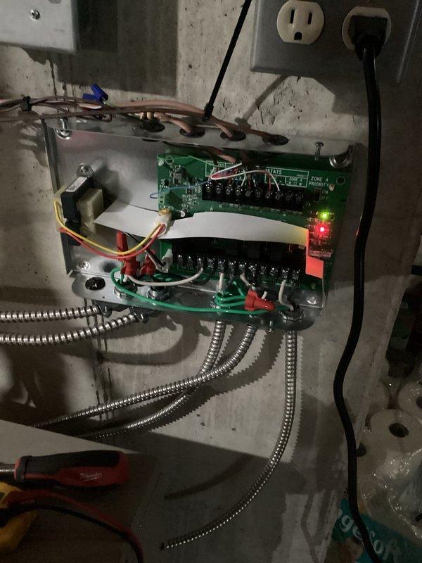 Installed basement thermostat per original quote and configured wiring on zone board to address heat zone issues. Adjusted pump speeds and pressures to balance heating loop distribution and ensure proportional output. Verified system operation via control board indicators and digital thermostat functionality.