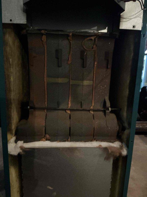 Performed annual preventive maintenance on approximately 7-year-old boiler system. Inspection revealed significant oxidation on copper heat exchanger components. Documented condition of installation including expansion tank, venting, and associated plumbing infrastructure for service records.