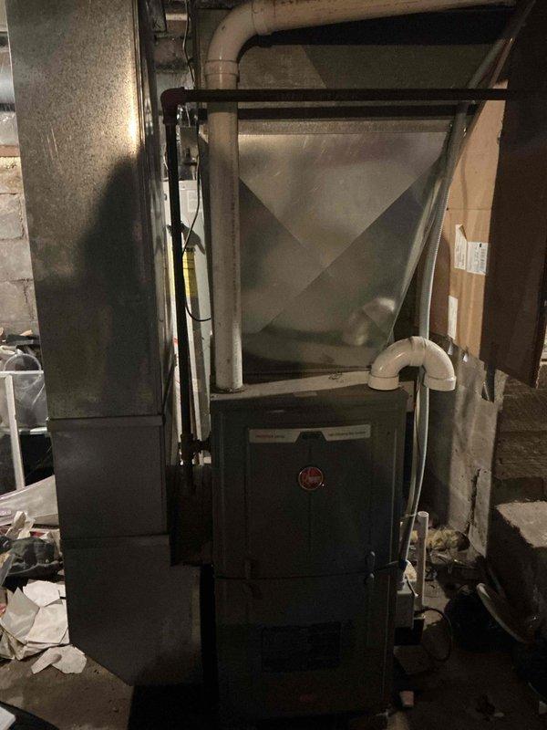 Responded to no-heat service call on a 7-year-old residential furnace. Diagnostic testing revealed a failed pressure switch preventing system operation. Removed defective low pressure switch and installed replacement component. System now functioning properly with normal heating operation resumed.