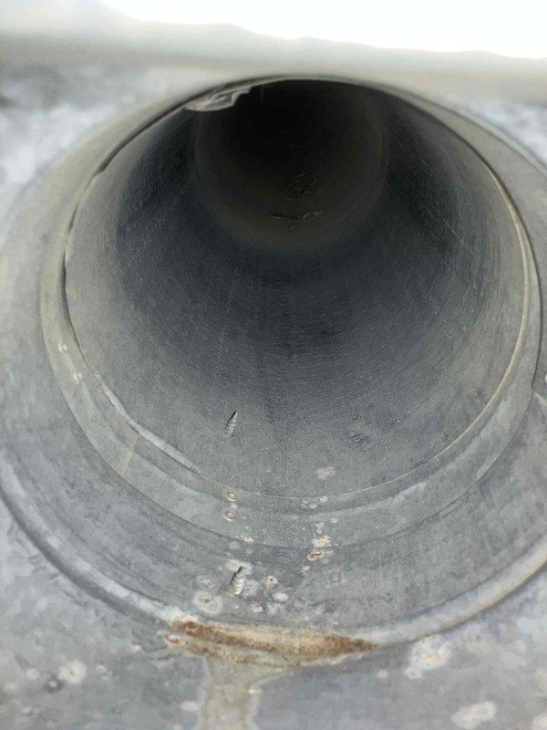 Inspected ductwork system and identified accumulation of dust and minor deposits along the interior walls and bottom surfaces of cylindrical metal ducts. Scheduled complete duct cleaning service for customer in the coming two weeks to remove these contaminants and improve system airflow.