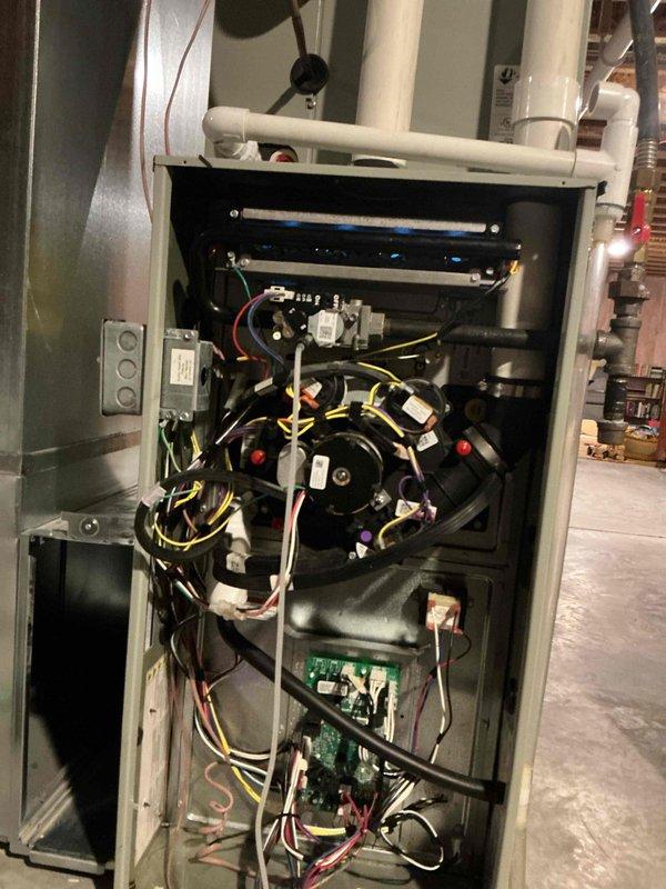 Performed burner assembly maintenance on furnace by replacing four existing burners with compatible OEM parts (BNR01233 1/2" ID Inshot Burners) and installed new brass orifices (ORF01427 #45). Conducted pressure testing using a differential manometer confirming proper gas supply at 3.5 inches WC and verified correct operation of the heating system after repair.