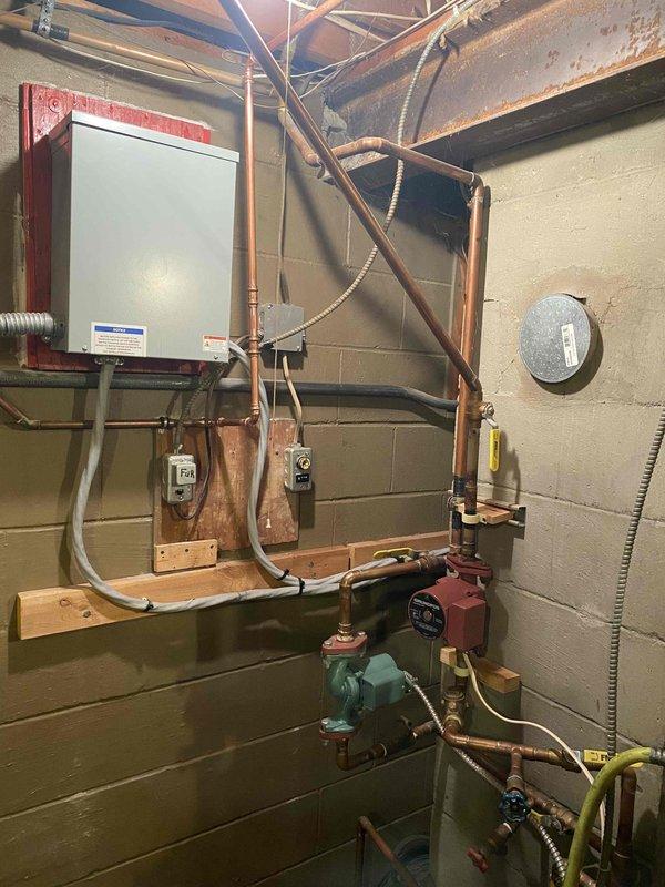 Completed comprehensive boiler system overhaul including drain and purge with cleaner flush. Replaced customer-supplied circulating pumps and control module along with installation of new expansion tank with shut-off valve, three boiler drain valves, pilot assembly, relief valve, auto feed backflow preventer, and upgraded air separation. System restored to full operational condition with all components properly installed and tested.