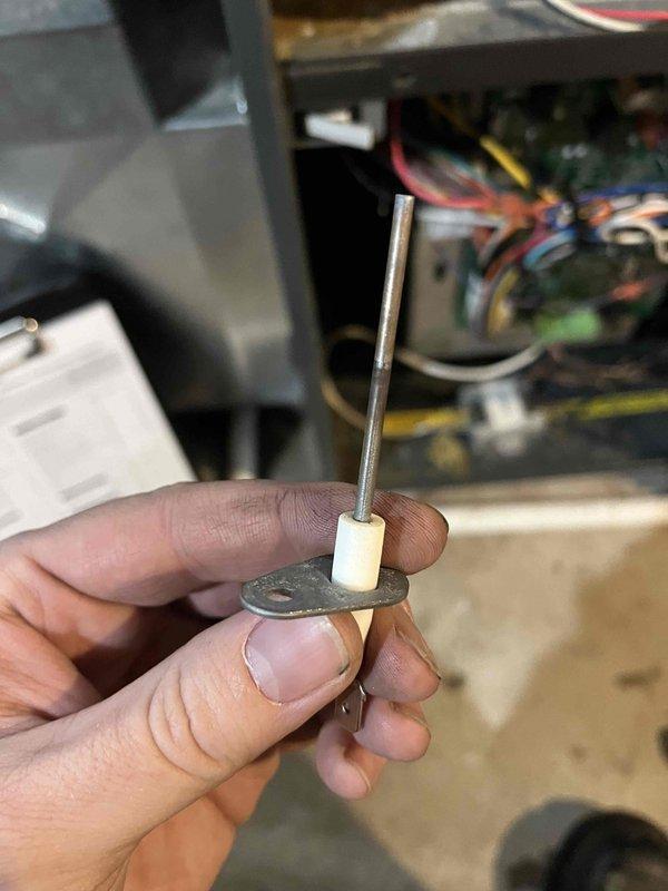 Performed annual preventative maintenance on furnace located under deck steps (lake side). Inspection revealed significant corrosion affecting the flame sensor, burners, and igniter. Removed and examined flame sensor to assess condition. Provided customer with estimates for necessary component replacement.