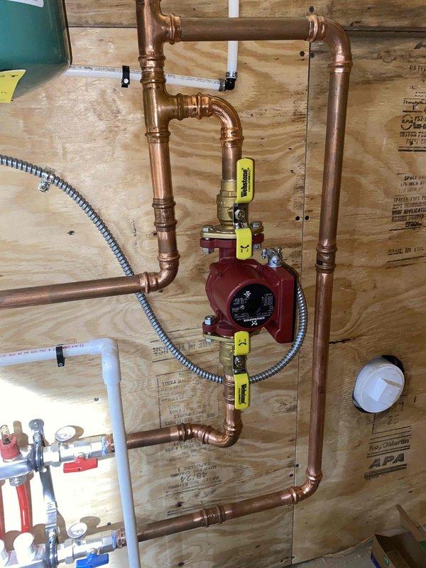 Relocated existing Grundfos circulation pump (PN 59896341P1) for the Navian in-floor heat boiler system in shop area as requested by customer. Installed copper piping with brass fittings and control valves to complete the relocation. Performed diagnostic evaluation on the system to verify proper operation and prevent potential line freezing.