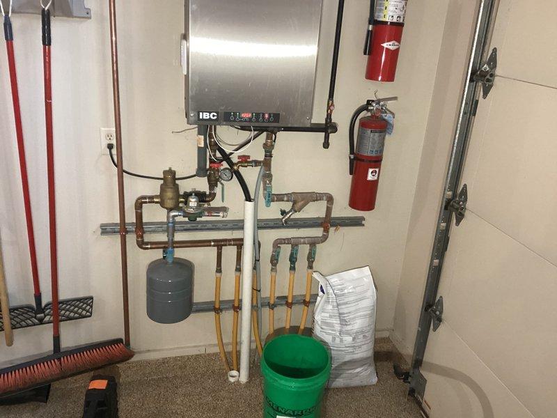 Diagnosed and serviced heated driveway system (99cod) which was experiencing low pressure issues. Installed auxiliary expansion tank and configured plumbing for primary/secondary loop operation to improve system functionality and pressure stability. Visual inspection of existing boiler and associated copper piping infrastructure was completed during service.