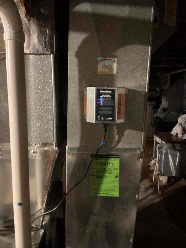 Responded to service call for IAQ system. Found humidifier with active corrosion causing water leak; water supply was shut off to prevent further damage. Located and repaired hole in humidifier line, restoring proper system function. Documented repair with photos of thermostat and HVAC unit.