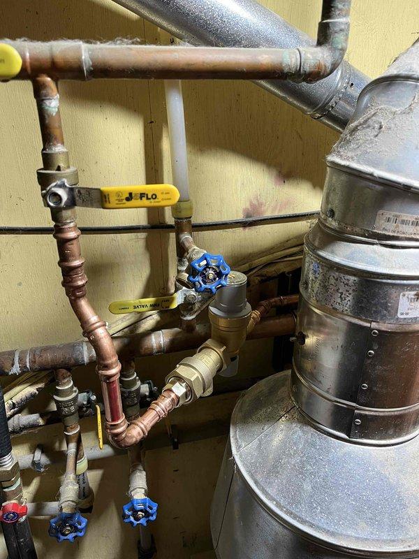 Responded to customer callback regarding boiler pressure and leakage concerns. Diagnostic assessment revealed pressure gauge reading incorrectly (showing 70 PSI when actual pressure was 35 PSI). Identified malfunctioning fill valve/backflow assembly, faulty relief valve, and inaccurate pressure gauge. Completed replacement of all three components to restore proper system function and pressure regulation.
