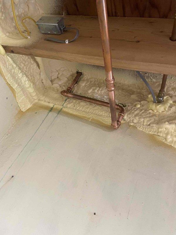 Repaired significant antifreeze leak in boiler system by replacing punctured copper pipe in the laundry room loop. Installed four isolation valves on supply lines to provide better system control and maintenance access. Recharged system with 2.5 gallons of antifreeze after completing repairs.