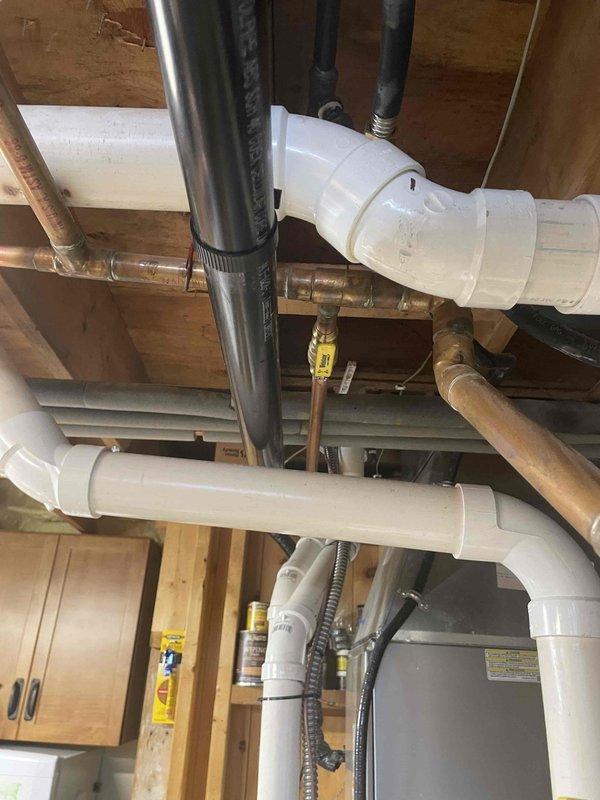 Repaired significant antifreeze leak in boiler system by replacing punctured copper pipe in the laundry room loop. Installed four isolation valves on supply lines to provide better system control and maintenance access. Recharged system with 2.5 gallons of antifreeze after completing repairs.