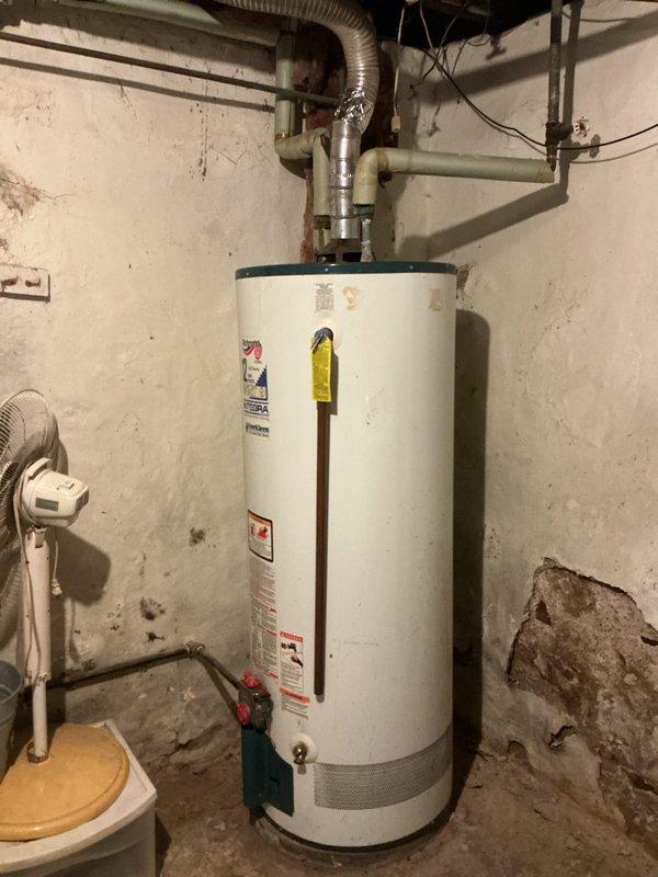 Completed annual tune-up on 1-year-old Lennox furnace system. Inspected and tested all components including ignition system, burners, heat exchanger, and electrical connections; all found to be in proper operating condition. Also examined nearby water heater installation, noting proper venting and connections, with recommendation for routine maintenance to prevent future issues.
