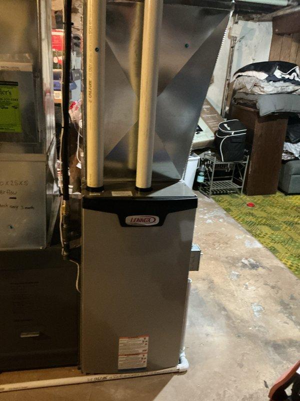 Completed annual tune-up on 1-year-old Lennox furnace system. Inspected and tested all components including ignition system, burners, heat exchanger, and electrical connections; all found to be in proper operating condition. Also examined nearby water heater installation, noting proper venting and connections, with recommendation for routine maintenance to prevent future issues.