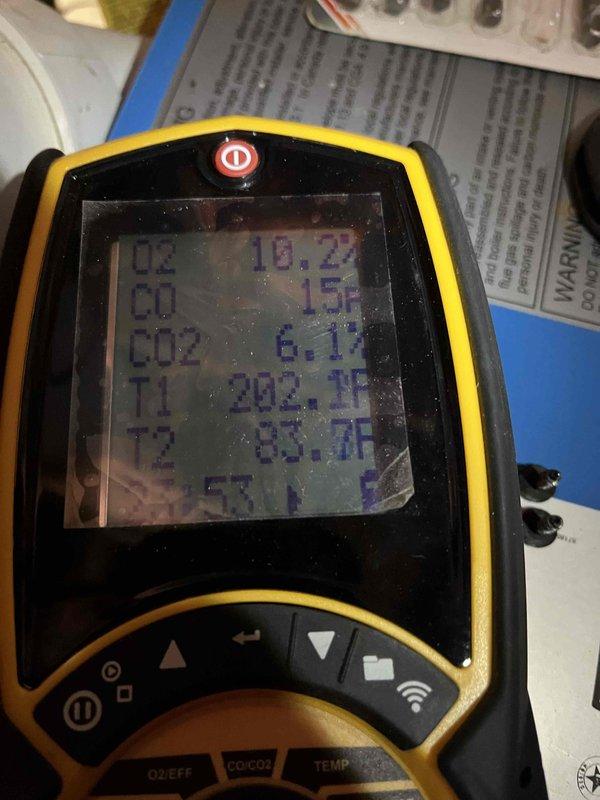 Performed annual inspection on boiler (unit #608 345 1117) under Partner Plan. Identified soot accumulation in burner chamber and excessive manifold gas pressure (9.3"WG). Adjusted pressure to manufacturer specification of 3.8"WG and verified proper combustion parameters with gas analyzer.