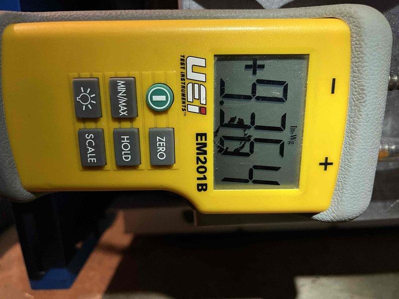 Performed annual inspection on boiler (unit #608 345 1117) under Partner Plan. Identified soot accumulation in burner chamber and excessive manifold gas pressure (9.3"WG). Adjusted pressure to manufacturer specification of 3.8"WG and verified proper combustion parameters with gas analyzer.