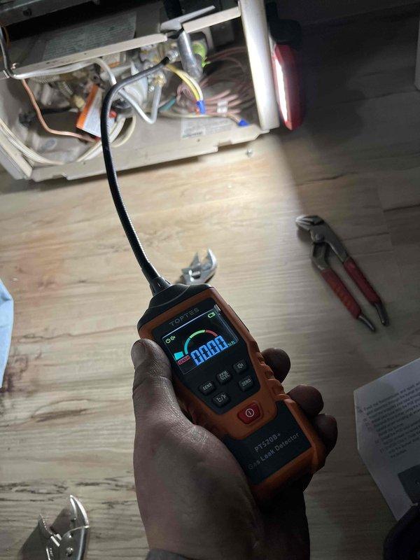 Completed removal and replacement of defective pilot assembly on customer's heating unit. Performed comprehensive test with electronic leak detector after installation to verify proper functionality of the new universal pilot assembly and associated gaskets. System now operating normally.