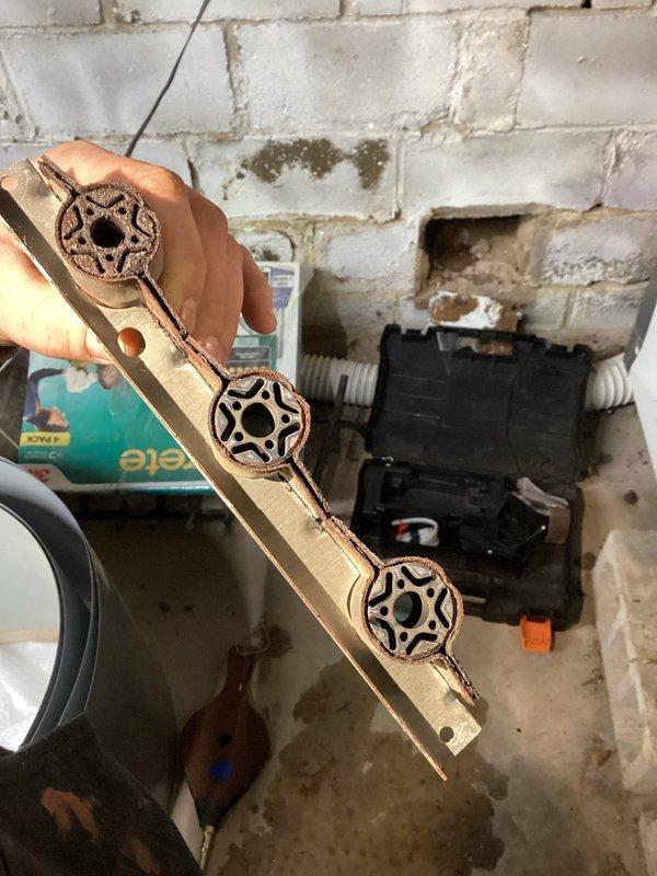 Performed follow-up diagnostic on 20-year-old furnace experiencing intermittent heating failure. Inspection revealed heavily corroded burners, compromised flame sensor, and inducer motor with audible bearing wear. Removed and inspected gas manifold assembly, found significant deterioration requiring replacement. Customer informed about repair options and availability of complete system replacement quote due to equipment age and condition.