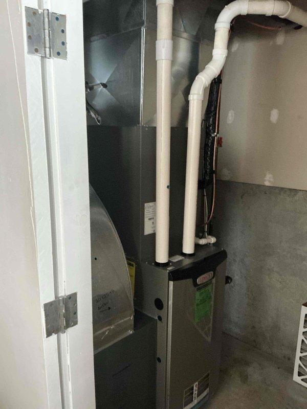 Completed annual maintenance on Lennox furnace system installed in utility area. Performed full inspection of unit, including verification of proper venting through PVC exhaust/intake pipes, inspection of ductwork connections, and replacement of air filter. System is functioning within manufacturer specifications with no operational issues detected.