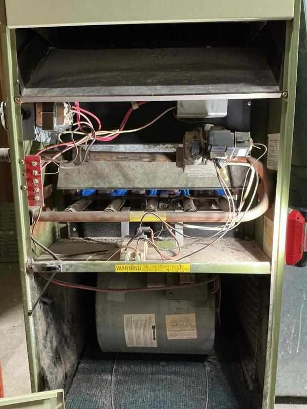 Diagnosed furnace failure due to faulty spark electrode preventing ignition. Upon inspection of 10+ year old unit showing significant dust accumulation and normal wear, replaced complete furnace system as recommended solution to restore heating functionality.