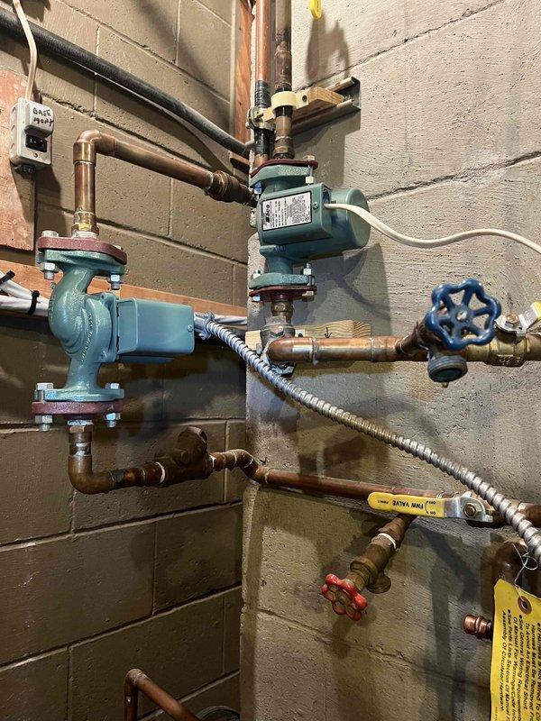 Returned to complete previously sold repair work as scheduled. Successfully replaced the control module, zone pump and pilot assembly on the heating system. Completed the job in the mechanical room where the existing furnace unit connects to a complex network of copper piping and circulation pumps mounted against concrete block walls.