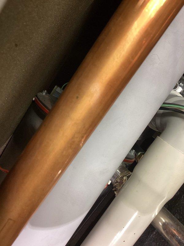 Responded to no-heat emergency at residential property with 10-year-old boiler system. Diagnostic inspection revealed faulty pressure sensor causing hot water interruption. Observed oxidation and corrosion on copper piping, with notable moisture accumulation within the mechanical enclosure. System repair requirements documented and customer advised of necessary replacement components.