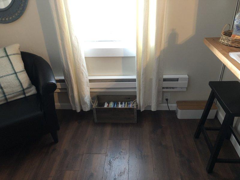 Completed installation of new baseboard heaters, including (1) 4-foot unit in small bedroom, (1) 4-foot unit in dining area, and (1) 6-foot unit under living room TV. Removed old wall furnace and capped chimney. All wiring was routed through attic space with wiremold installed along walls to baseboard locations. Final inspection and photo documentation of completed work was performed for client review.