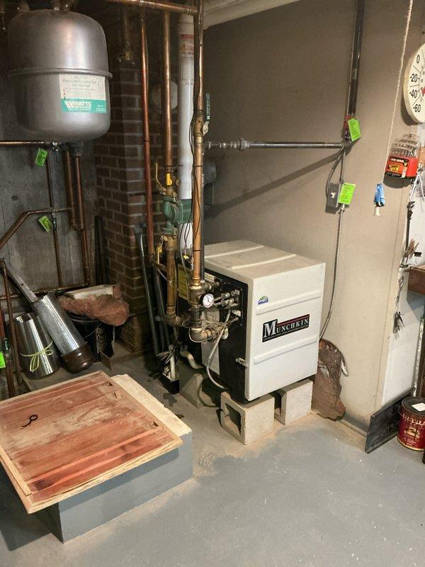 Responded to emergency no-heat call for relatively new Munchkin boiler system. Diagnosed boiler shutdown due to high temperature limit being triggered by a failing circulation pump. Replaced defective pump to restore proper water flow, which resolved the high temperature limit issue and restored normal heating operation.