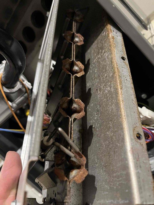 Performed annual inspection on 10-year-old furnace that experienced intermittent operation. Identified multiple system deficiencies including corroded heat exchanger, burners with significant oxidation, dead spots on flame sensor, ignitor corrosion, and misaligned inducer. Provided customer with equipment replacement options due to extent of deterioration and safety concerns.