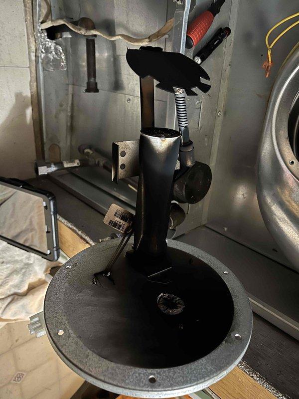 Diagnosed gas leak on propane furnace reported by customer with odor near exhaust and flame projection incident. Inspection revealed severely sooted burner chamber, compromised heat exchanger, and significant rodent deposits within the unit. Photos confirmed deteriorated components with visible corrosion. Recommended complete system replacement through comfort advisor due to safety concerns.