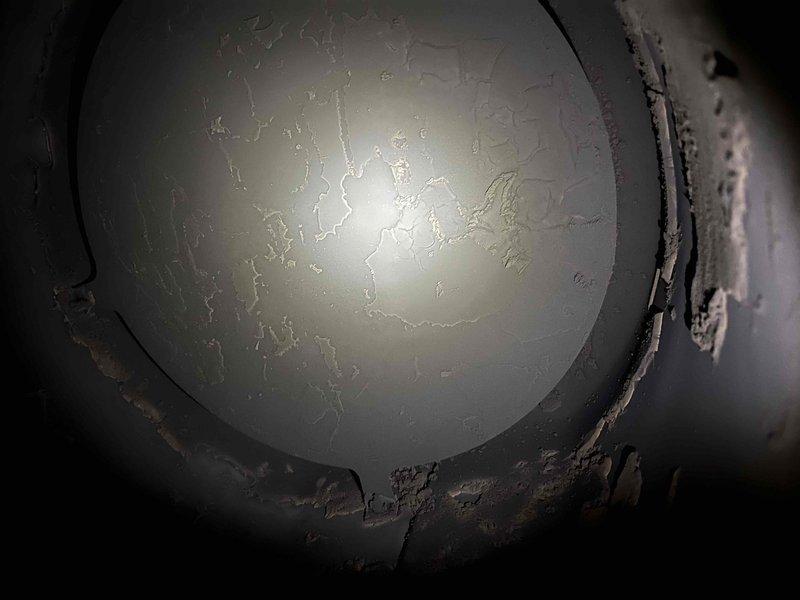 Diagnosed gas leak on propane furnace reported by customer with odor near exhaust and flame projection incident. Inspection revealed severely sooted burner chamber, compromised heat exchanger, and significant rodent deposits within the unit. Photos confirmed deteriorated components with visible corrosion. Recommended complete system replacement through comfort advisor due to safety concerns.