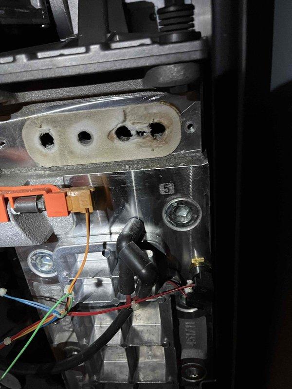 Completed annual heat inspection on customer's boiler as part of their Partner Plan maintenance. Identified deterioration of the damper and electrode assembly, evidenced by frost buildup on terminals and visible wear on ceramic components. Photos documented the condition, and prepared repair estimate for customer consideration.