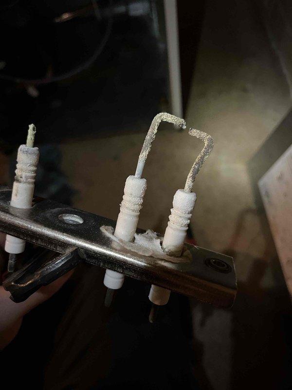 Completed annual heat inspection on customer's boiler as part of their Partner Plan maintenance. Identified deterioration of the damper and electrode assembly, evidenced by frost buildup on terminals and visible wear on ceramic components. Photos documented the condition, and prepared repair estimate for customer consideration.