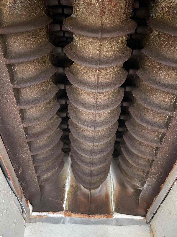 Completed 119 annual maintenance service on boiler system. Discovered failing capacitor, poor air separation, and significant aging of internal components including heat exchanger fins showing corrosion. Diagnostic testing revealed high temperature readings (202°) with visible condensation issues. Multiple repair options and potential system replacement were discussed with customer.