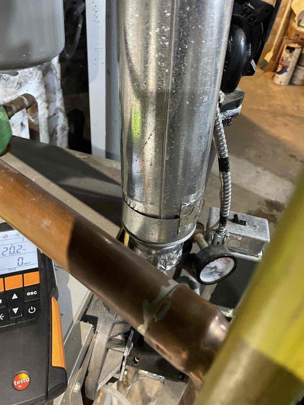 Completed 119 annual maintenance service on boiler system. Discovered failing capacitor, poor air separation, and significant aging of internal components including heat exchanger fins showing corrosion. Diagnostic testing revealed high temperature readings (202°) with visible condensation issues. Multiple repair options and potential system replacement were discussed with customer.