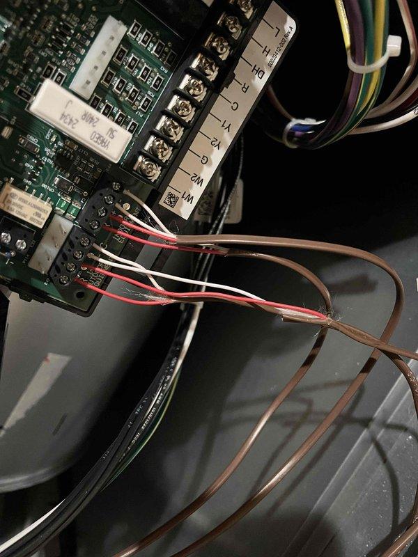 Responded to urgent system alarm on Lennox equipment. Diagnosed communication failure between heat pump and furnace due to damaged thermostat wiring. Repaired wiring connections at control board terminals, restoring proper system communication and resolving the alarm condition.