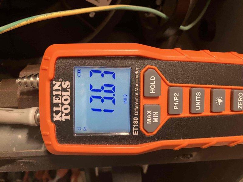 Diagnosed 4-year-old Goodman LP furnace making abnormal "poof" noise during startup. Testing with manometer revealed high incoming gas pressure and inspection found dirty burners causing ignition issues. Replaced burners and had gas regulator adjusted to restore proper operation and eliminate noise.