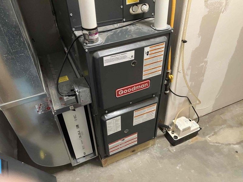 Diagnosed 4-year-old Goodman LP furnace making abnormal "poof" noise during startup. Testing with manometer revealed high incoming gas pressure and inspection found dirty burners causing ignition issues. Replaced burners and had gas regulator adjusted to restore proper operation and eliminate noise.