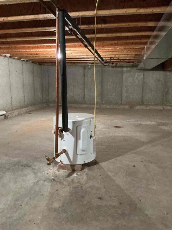 Completed prepaid annual maintenance service on two furnaces - one located in the basement and one in the crawl space. Inspected water heater system with copper piping and valves, noting normal condition. No operational issues identified during service.