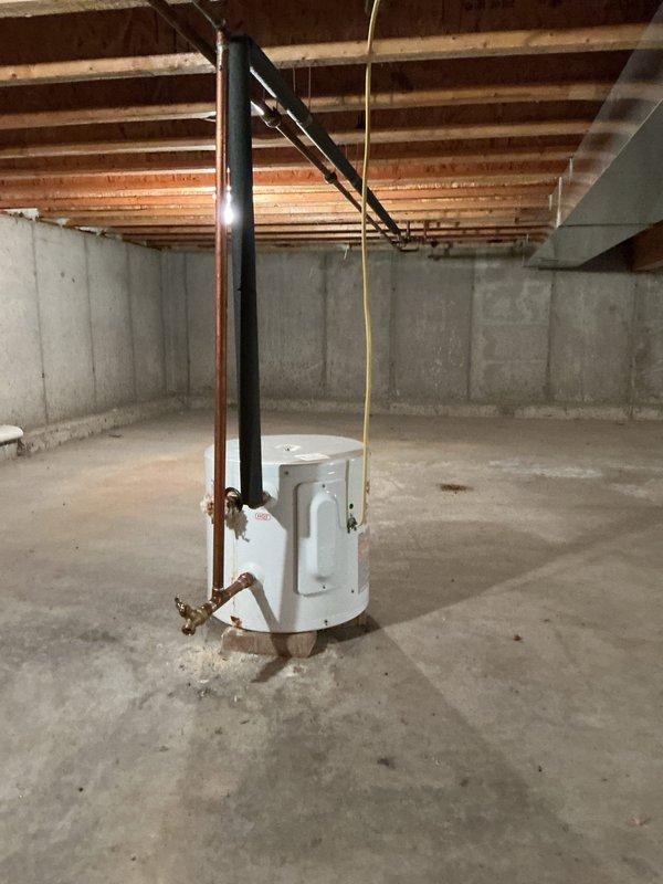 Completed prepaid annual maintenance service on two furnaces - one located in the basement and one in the crawl space. Inspected water heater system with copper piping and valves, noting normal condition. No operational issues identified during service.
