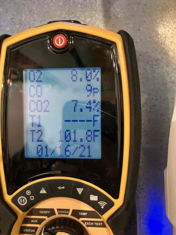Performed annual preventive maintenance inspection on 20-year-old furnace. Conducted combustion analysis with readings showing O2 at 8.0%, CO at 9P, and CO2 at 7.4%. Inspected blower wheel assembly which showed normal dust accumulation consistent with age of unit.